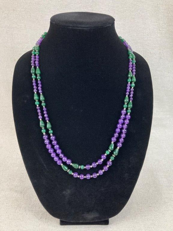 Amethyst and Aventurine Beaded Necklace: This stunning double strand necklace features polished amethyst and aventurine beads in vibrant colors, with the longest strand measuring approximately 44 in. The strands remain in good condition, wit