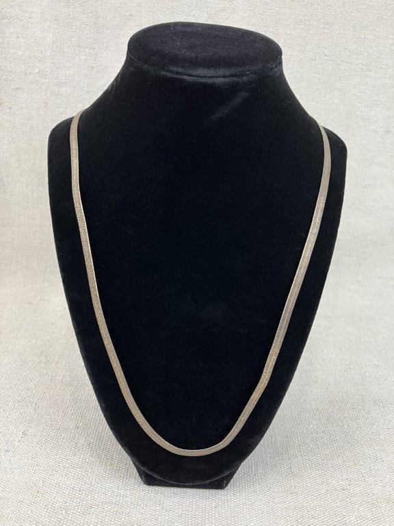 Sterling Silver Herringbone Chain Necklace: Sterling silver necklace in a robust herringbone pattern with smooth, fluid links and distinctive reflective surface, clasp marked 925 for silver content. Measures approx. 20" in length. Total weight