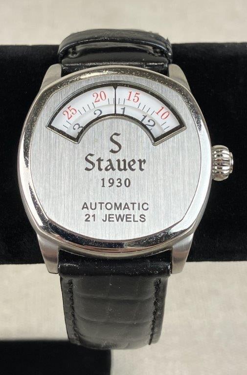 Stauer 1930 Dashtronic Automatic Watch: A retro-inspired timepiece by Stauer, modeled after the avant-garde "jump-hour" styles of the 1930s. This watch utilizes a 21-jewel automatic movement to drive a unique time-telling system of