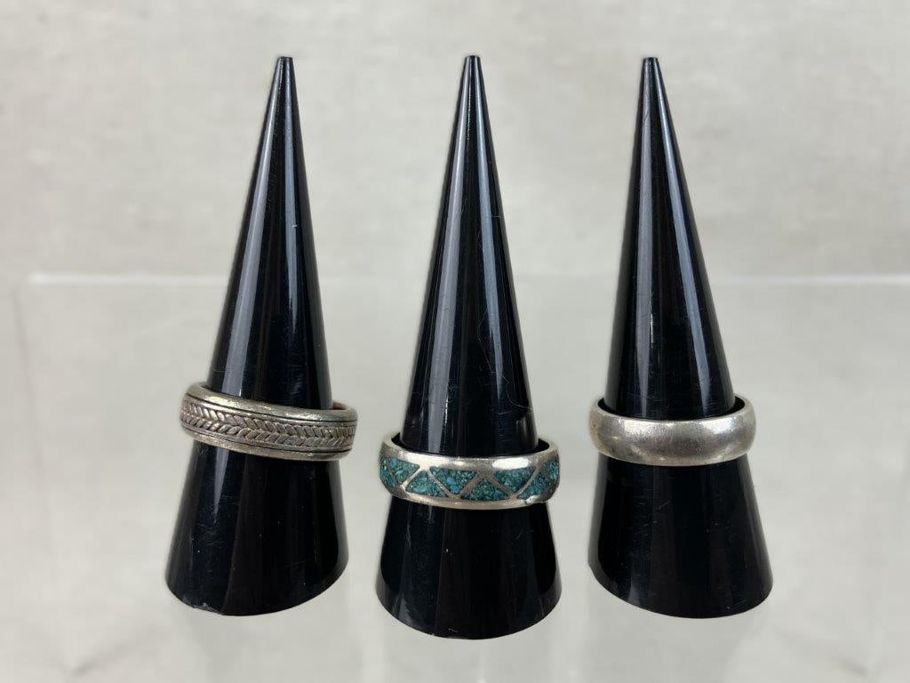 Vintage Sterling Silver Rings: This three-piece assortment of vintage sterling silver band rings features a versatile mix of traditional and Southwestern-inspired styles. The assortment includes a Navajo-style sterling silver ring