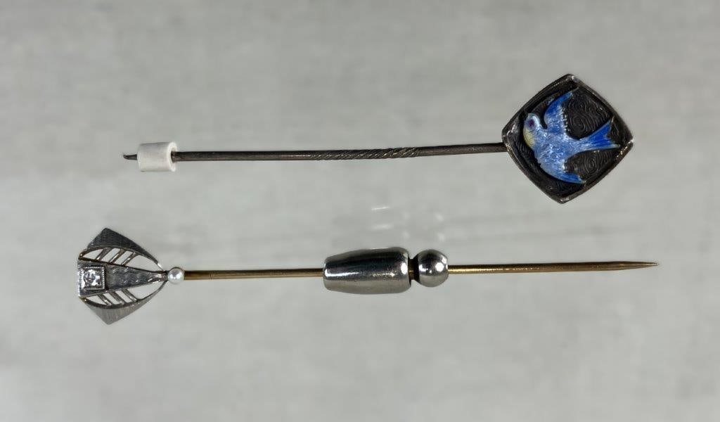 Vintage 14K Gold and Sterling Silver Stick Pins: Two beautiful vintage stick pins including distinct gold and sterling silver designs. The lot includes a 14K gold stick pin with a small diamond set in a geometric top and a small natural pearl below 