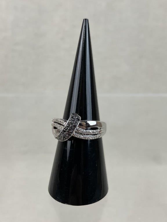 Sterling Silver and Marcasite Mom Ribbon Ring: Sterling silver ring in a ribbon form design, featuring the word "Mom" in a raised gallery with a heart motif forming the "O" accented by small, faceted marcasite stones and textured sterling