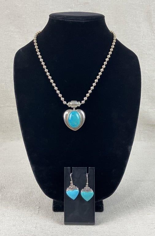 Joseph Esposito Sterling Silver Necklace and Earrings: This jewelry collection features a Joseph Esposito sterling silver necklace and a separate pair of sterling silver earrings. The necklace centers on a heart-shaped pendant featuring a central oval