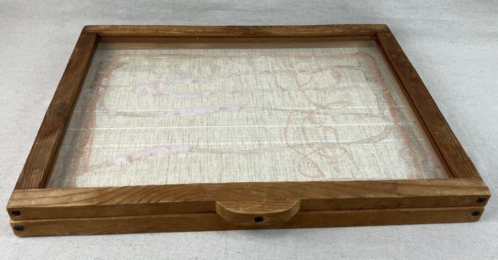 Display Case: This wooden display case, ideal for showcasing jewelry or antique collections, features a classic wood exterior and a clear glass top with a convenient hinged lid. Measuring approximately 1 7/8 in. H