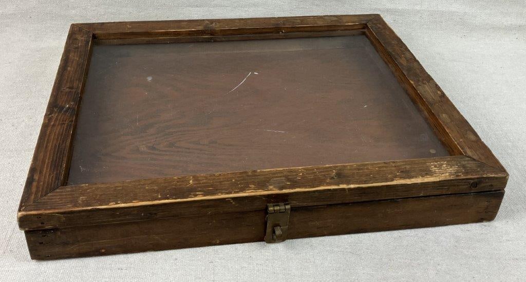Display Case: This wooden display case, ideal for showcasing jewelry or antique collections, features a classic wood exterior and a clear glass top with a convenient hinged lid. Measuring approximately 2 1/8 in. H