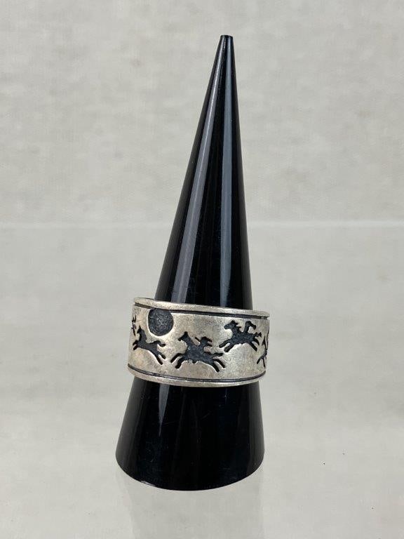 Native American Sterling Silver Running Horse Ring: Sterling silver ring in a bold statement band form, decorated throughout with a continuous running horse and rider motif. Unmarked but tested for sterling content. Ring size approx. 10. Total weight