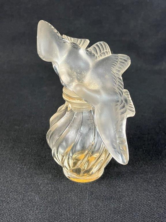 Signed Lalique Art Glass Dove Perfume Bottle: Frosted and clear art glass perfume bottle by Lalique, featuring the iconic stopper with two kissing doves above a swirling molded glass body, signed Lalique with engraved signature to the base and