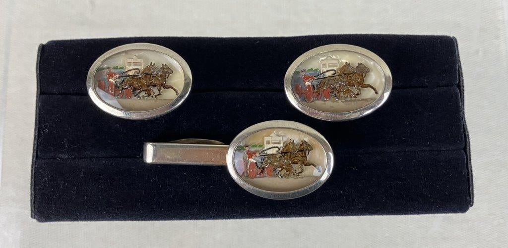 Vintage Diorama Cufflinks and Tie Clip: This vintage silver-tone set features reverse-carved diorama cufflinks and a matching tie clip, both intricately depicting a carriage racing scene. The tie clip measures approximately 2 in. L x 3/4 in