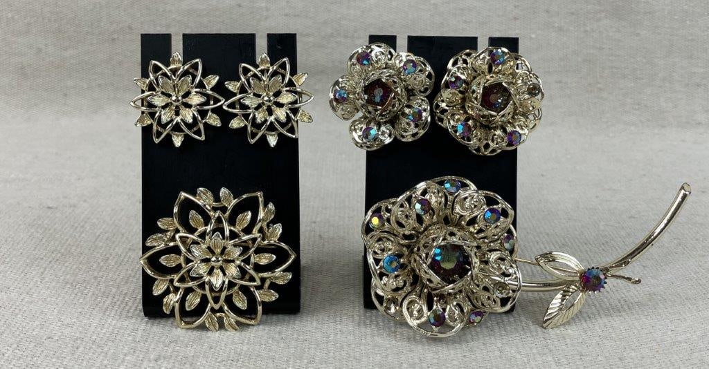 Sarah Coventry Floral Brooches and Earrings: This vintage collection features two distinct floral designs from Sarah Coventry, both signed "Sarah Cov". The first is the "Fashion Flower" set, featuring a gold-tone brooch and matching earrings
