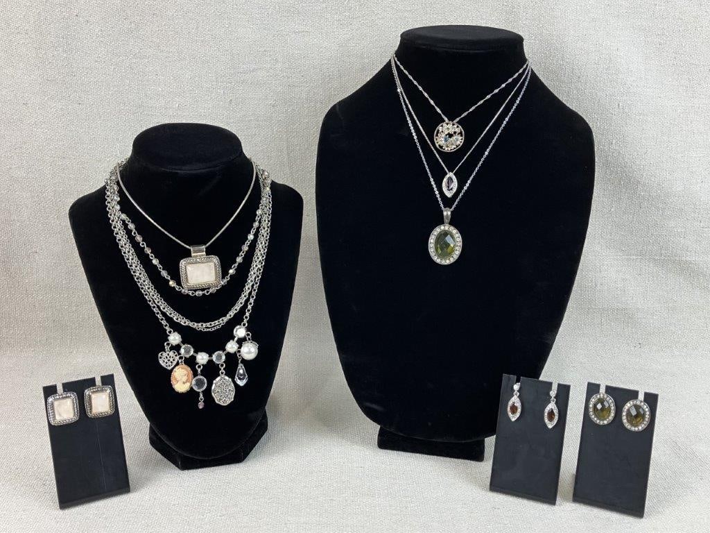 Assortment of Silver-tone and Gemstone Jewelry: This eight-piece collection of vintage silver-tone costume jewelry features a sophisticated blend of natural stones and classic metalwork. Highlights include a Roman necklace and earring set