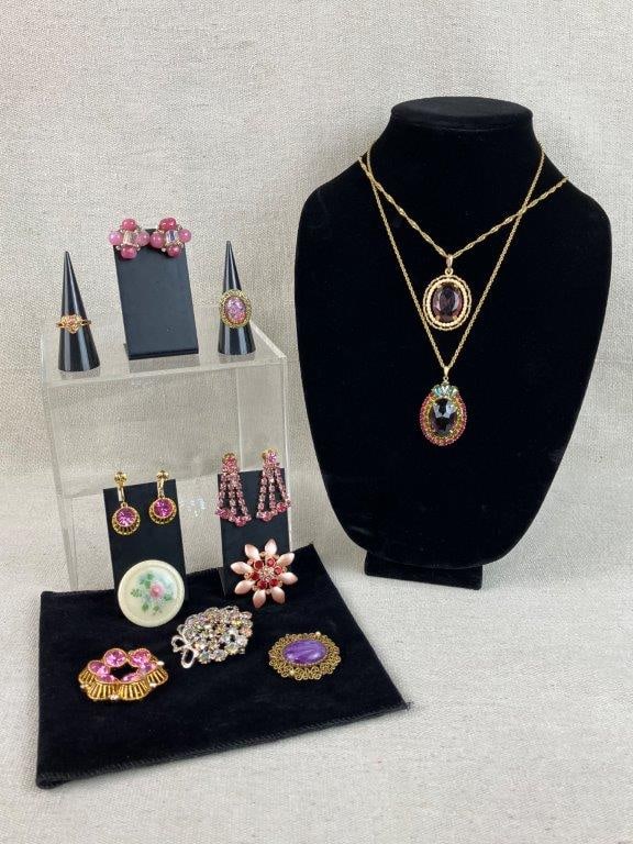 Collection of Purple and Pink Gemstone Jewelry: This thirteen-piece jewelry collection features a vibrant palette of violets, pinks, and iridescent tones. Notable highlights include a silver-tone brooch shimmering with Aurora Borealis rhinestones, 
