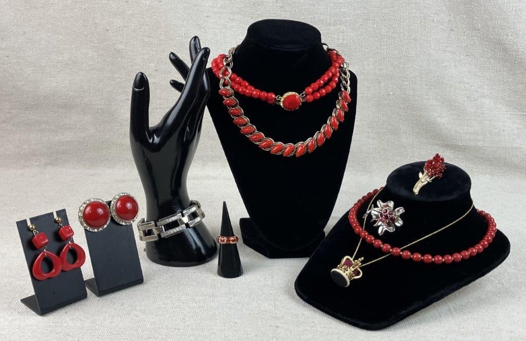 Scarlet Costume Jewelry Assortment: A vibrant assortment featuring an array of pieces united by their bold red decorations and contrasting finishes. Included is a two-strand faceted glass bead necklace featuring a central red faceted