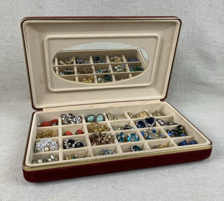Assortment of Vintage Costume Earrings with Velvet Box: This twenty-five-pair collection of vintage costume earrings offers a vast range of mid-century styles and signed pieces. Notable highlights include a pair of gold-tone earrings featuring red Lucite