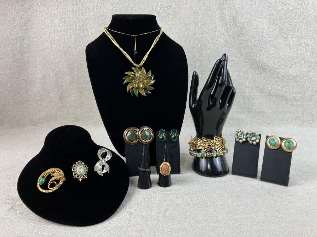 Costume Jewelry Assortment Including Monet, Sarah Coventry, and Napier: Group of thirteen pieces of vintage costume jewelry, including a cameo ring in a gold tone setting by Sarah Coventry, a pair of gold tone earrings by Napier set with a central green acrylic stone, a p