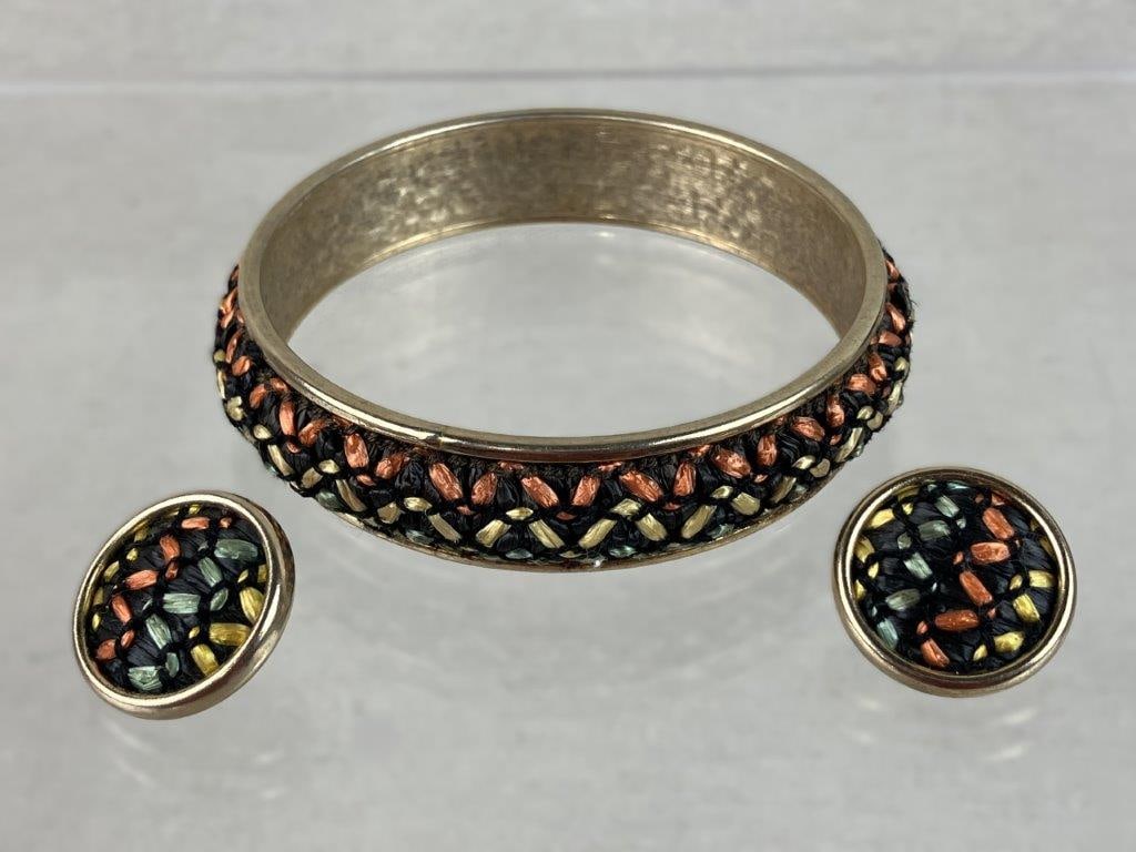 Sarah Coventry Gold Tone Basket Weave Bangle and Earrings,1964: Vintage costume jewelry set by Sarah Coventry, including a chunky bangle bracelet and matching clip-on earrings in the "Indian Princess" pattern, featuring a central basketweave design in a gold tone