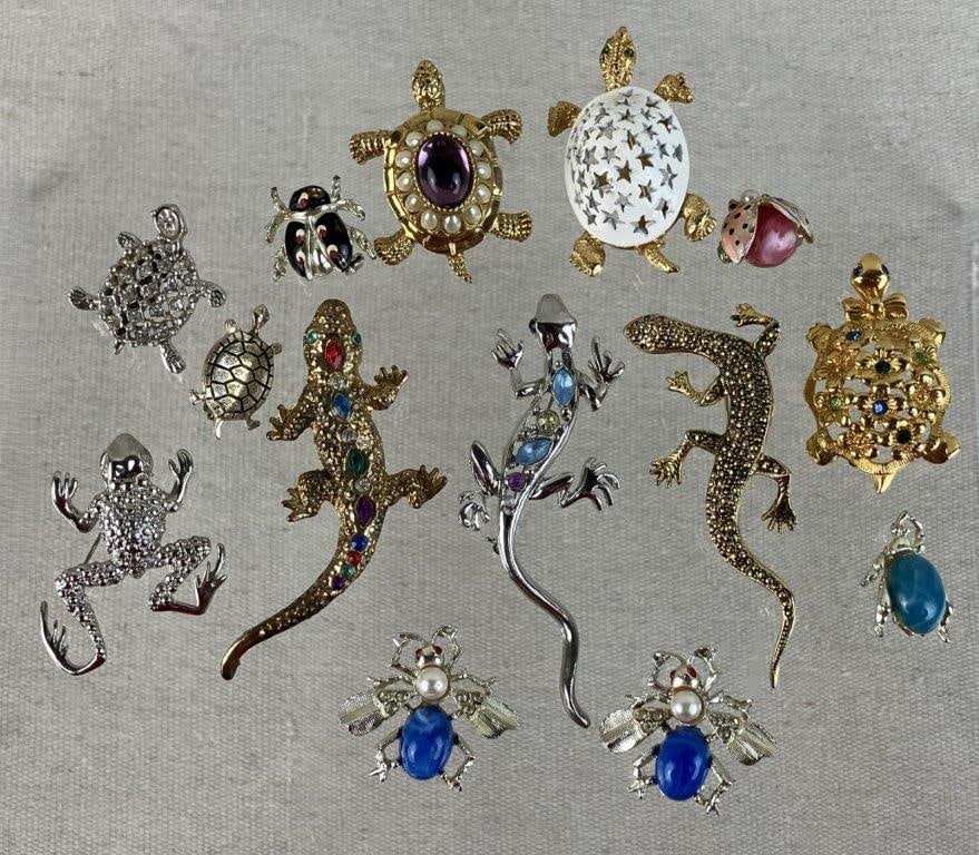 Collection of Reptile and Insect Brooches: This fourteen-piece collection of costume jewelry celebrates a whimsical garden of cold-blooded and multi-legged creatures. The set features eight turtles and lizards, many of which are embellished