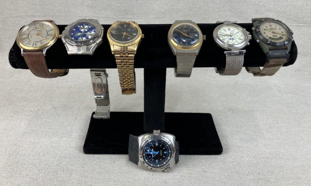 Assorted Luxury Wristwatches Including TAG Heuer: This collection of vintage timepieces features a high-end TAG Heuer men's watch with a band measuring approximately 8 in. L. The assortment also includes a men's Remington Electra with a striking blue