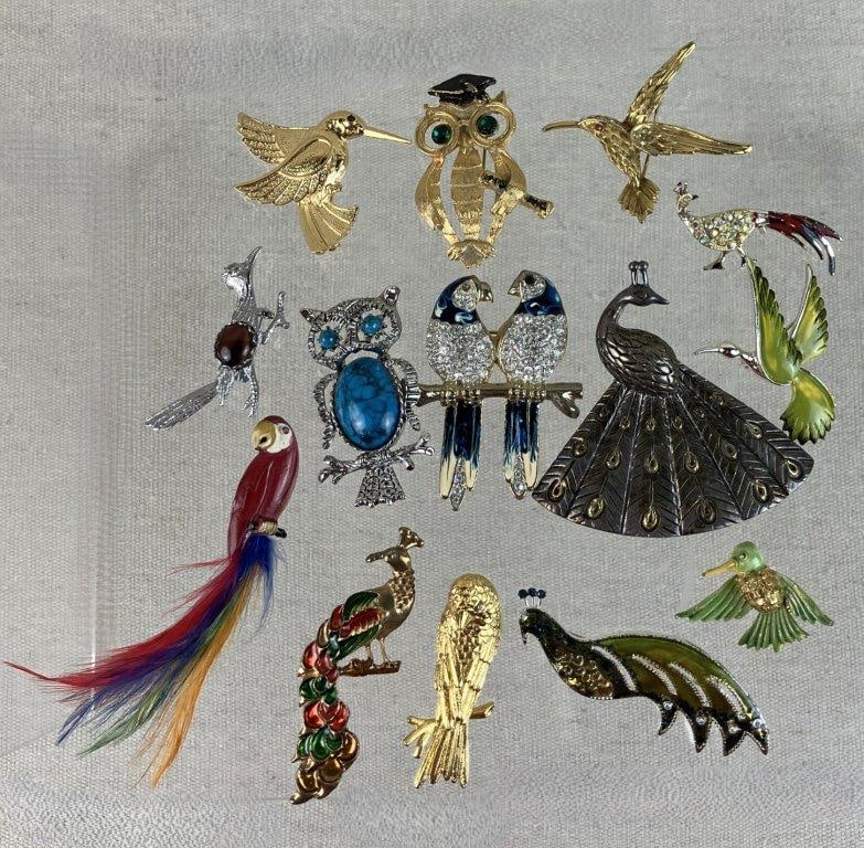 Collection of Bird Brooches: This fourteen-piece collection of decorative pins showcases a charming variety of avian designs, ranging from classic elegance to playful novelty. Notable highlights include a silver-tone peacock