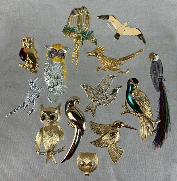 Collection of Bird Brooches: This thirteen-piece collection of bird-themed jewelry offers a colorful variety of species and decorative finishes, perfect for the avid avian enthusiast. Highlights include a gold-tone bird