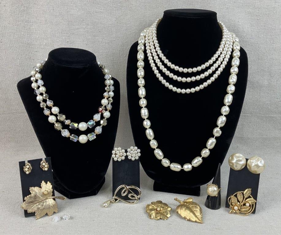 Assortment of Faux Pearl Jewelry Including Sarah Coventry, Avon, and Judy Lee: This twelve-piece collection of vintage costume jewelry celebrates the timeless elegance of faux pearls in various classic settings. The highlight of the assortment is a gold-tone Sarah Coventry leaf 
