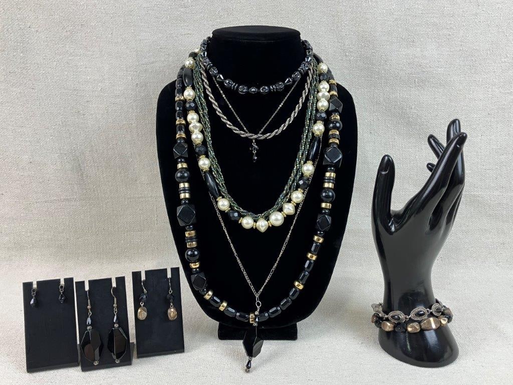Beaded Vintage Costume Jewelry Collection: This twelve-piece collection of beaded vintage costume jewelry showcases a variety of dark and black tones, headlined by a standout opera-length necklace featuring dimensional black acrylic beads and 