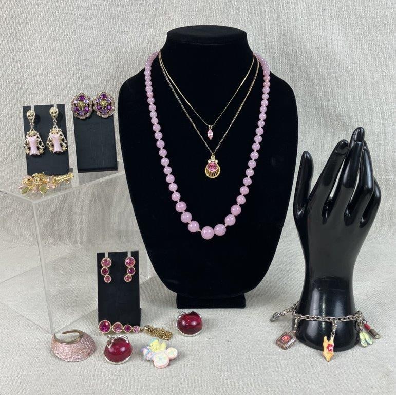 Pink Themed Costume Jewelry Assortment Including Sarah Coventry: Group of twelve pieces of vintage costume jewelry in pink tones, including a standout pair of clip-on earrings by Sarah Coventry set with three pink rhinestones and a matching brooch, three necklaces