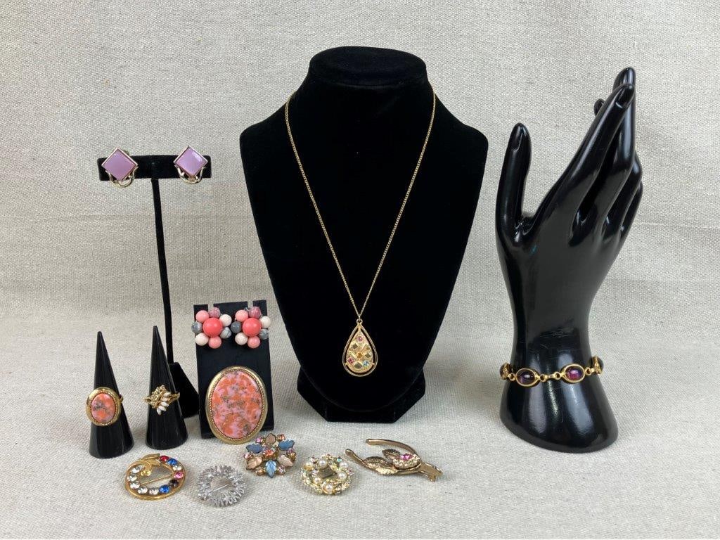 Gold-Tone Jewelry Assortment Including Sarah Coventry: This twelve-piece collection of vintage gold-tone costume jewelry features a soft pink and feminine color palette, headlined by a matching Sarah Coventry brooch and ring set with a pink central