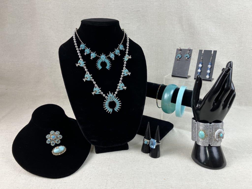 Turquoise-Toned Costume Jewelry Assortment Including Sarah Coventry: Group of twelve pieces of vintage costume jewelry in turquoise tones, including two adjustable rings by Sarah Coventry, one set with a turquoise-toned stone and the other with a transparent blue