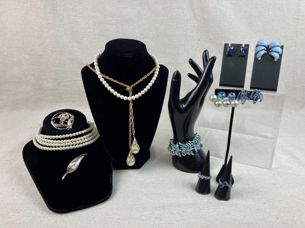 Collection of Faux Pearl Jewelry: This collection brings together the timeless elegance of faux pearls with refreshing light blue accents. The set includes two faux pearl necklaces, with one example featuring a longer strand of 51 1/2