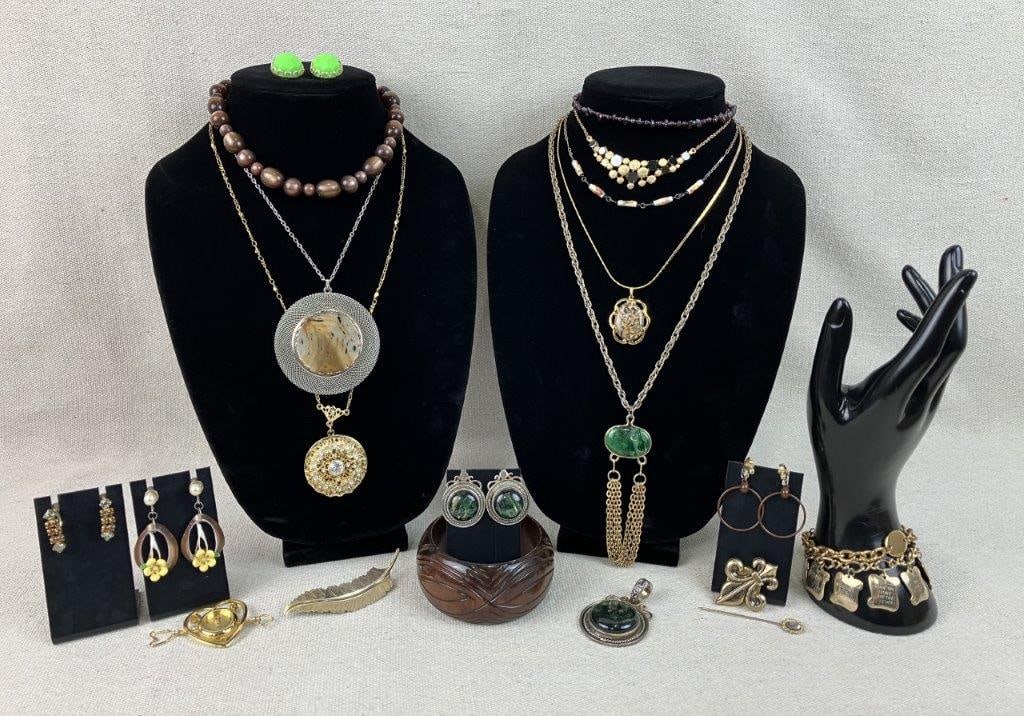 Assortment of Costume Jewelry Including Sarah Coventry: This twenty-two piece collection of vintage costume jewelry highlights a diverse range of materials and themes, featuring a Sarah Coventry necklace with a swirled faux green stone and dangling chains