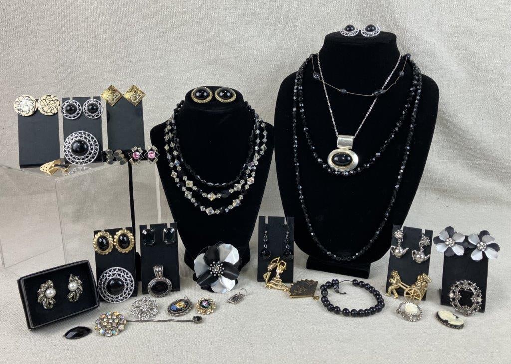 Assorted Vintage Costume Jewelry: This thirty-five-piece variety of vintage costume jewelry includes a wide range of enamel, gold-tone, and silver-tone designs accented with rhinestones and more. A standout piece in the collection is