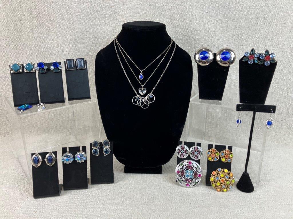 Costume Jewelry Assortment Including Sarah Coventry: This seventeen-piece assortment of vintage costume jewelry features a vibrant variety of designs, many centered around a blue-toned rhinestone and acrylic color palette. The collection is highlighted 