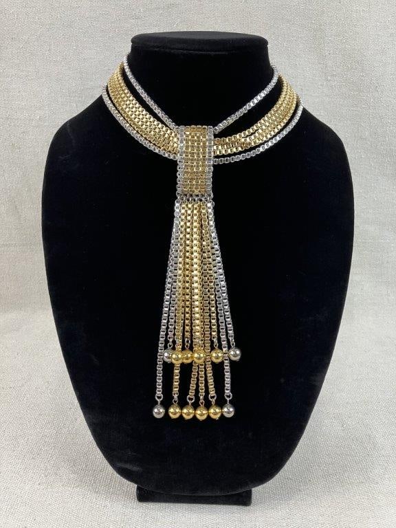 Vintage Gold Master Box Chain Tassel Necklace: This Vintage Gold Master necklace features a two-tone lariat-style layout constructed from alternating rows of gold-tone and silver-tone box chains with a central band that holds the pattern