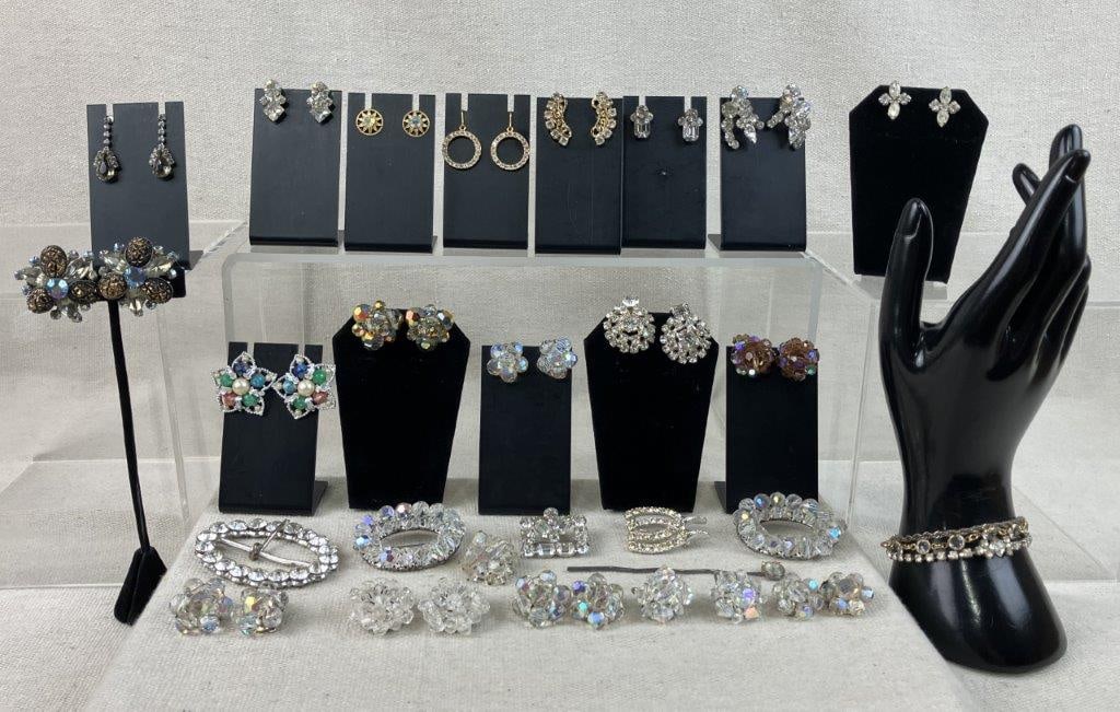 Vintage Rhinestone Jewelry Assortment: This twenty-eight-piece assortment of vintage rhinestone jewelry features an array of accessories each decorated with multi faceted rhinestones, headlined by a standout pair of dangle earrings with a