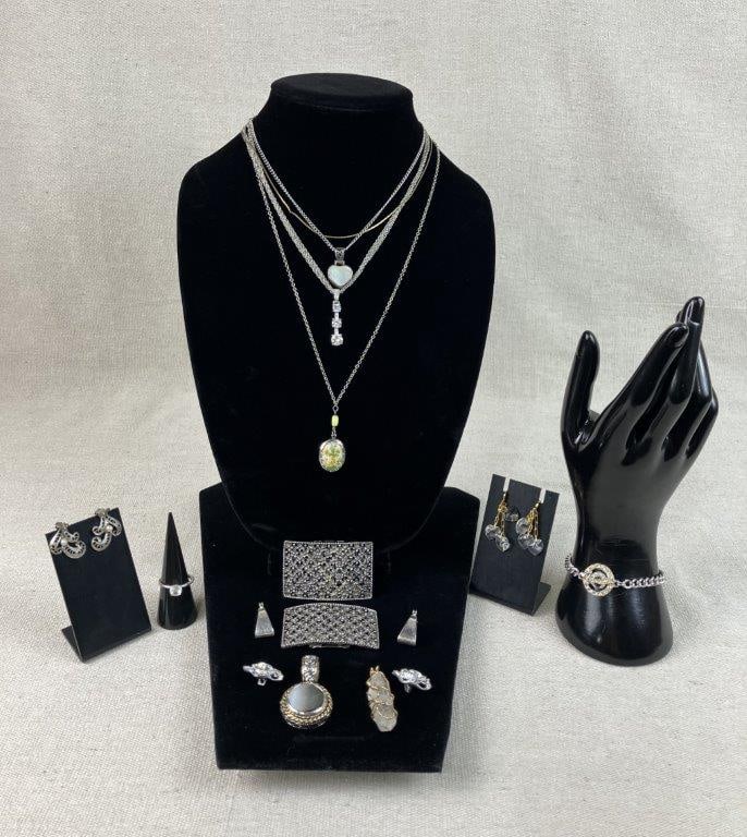 Silver-Tone Costume Jewelry Assortment Featuring Tiptoe and Avon: This thirteen-piece silver-tone costume jewelry collection highlights elegant floral motifs and classic vintage branding. The set includes a pair of matching shoe clips by Tiptoe featuring floral