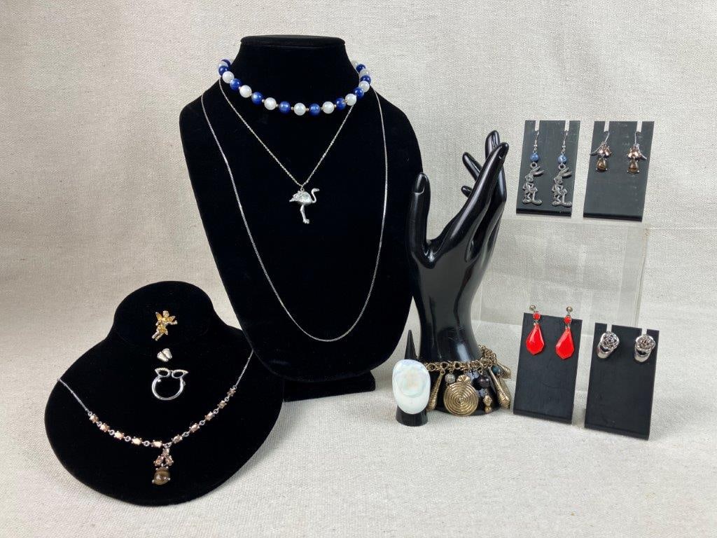 Costume Jewelry Assortment: This twelve-piece collection of vintage and contemporary costume jewelry offers a playful mix of materials and styles. Standout items include a vintage pearlescent white lucite ring (approx. size 6)