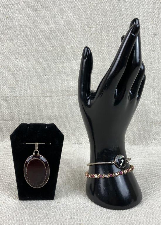 Sterling Silver Jewelry Assortment: This sterling silver jewelry group combines classic gemstone elegance with vintage artisan craftsmanship. The assortment includes a tennis bracelet featuring gold vermeil over sterling silver, decorat