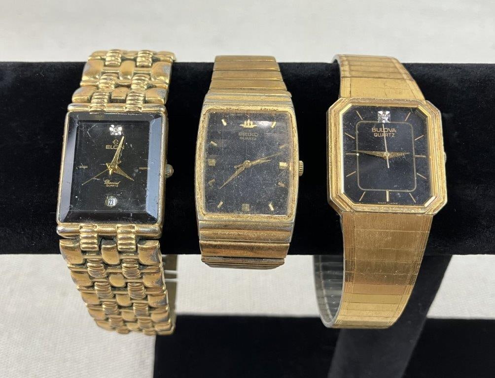 Men's Luxury Wristwatch Assortment Including Bulova and Elgin: This three-piece men's wristwatch assortment features a selection of classic designs highlighted by a vintage Bulova with a gold electroplated band, a sophisticated black dial, and a single diamond