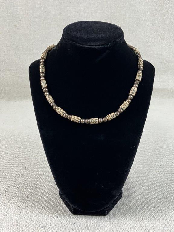 Sterling Silver and Animal Print Bead Necklace: This elegant necklace features polished sterling silver beads interspersed with animal print patterned beads, creating a sophisticated yet bold aesthetic. Total weight including all materials