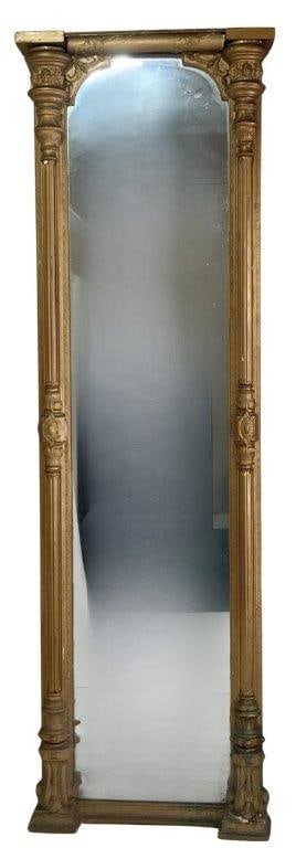 19th Century Ornate Pier Mirror: An impressive 19th century ornate pier mirror of substantial size and stature, featuring richly detailed columns flanking either side of the mirror plate. The piece exhibits grand proportions and