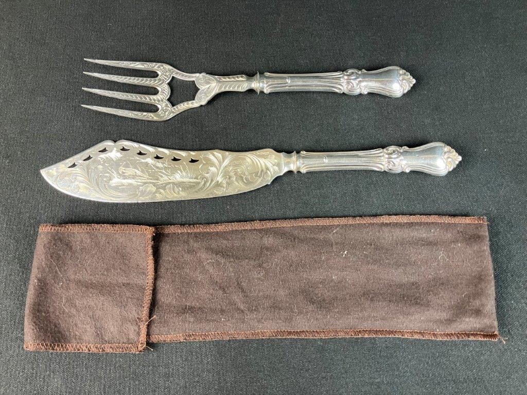 Albert Coles Coin Silver Fish Serving Set: This elegant mid-19th-century coin silver serving set by prominent silversmith Albert Coles includes a serving knife and a matching four-prong serving fork. The knife features a distinctive