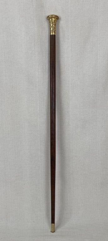 Fine Gold Plated Knob Cane: A stunning fine gold plated knob cane featuring ornate scrollwork on the handle and a hammered gold plated ferrule. The piece displays elegant detailing and rich decorative appeal. Measures approximat