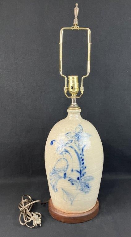 Cobalt Decorated Stoneware Jug: This handsome salt-glazed stoneware jug lamp features a classic rounded form with an applied handle and a rich, soft glaze. The vessel is beautifully embellished with a vibrant cobalt blue floral