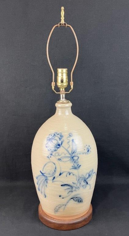 Cobalt Decorated Stoneware Jug: This handsome salt-glazed stoneware jug lamp features a classic rounded form with an applied handle, expertly converted into a striking table lamp. The vessel is beautifully embellished with an