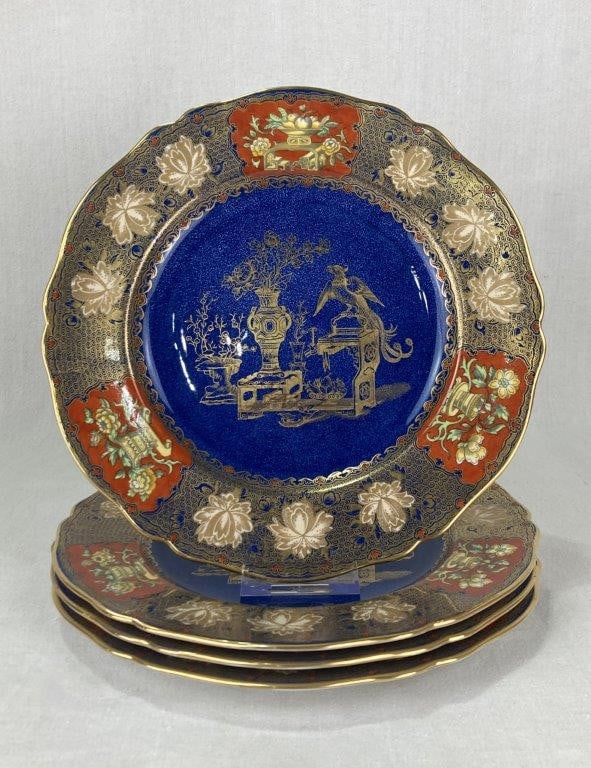 Copeland Spode Macaw Porcelain Plates: Produced by Spode during the Copeland era, each plate features a striking cobalt blue (lapis lazuli) central ground decorated with a Chinoiserie motif of a macaw bird, presentation tables, and