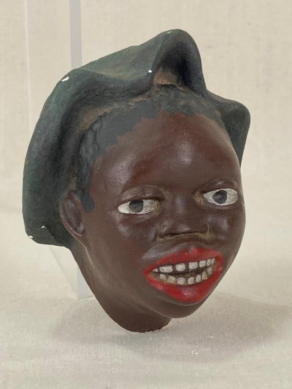 Black Americana Wall Sconce: This vintage chalkware wall sconce is expressively molded in the form of an African American woman's head, featuring hand-painted facial features. The piece is designed with an integrated cylindrical