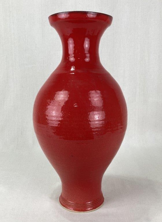 Ouida Stoneware Pottery Vase: An art pottery vase by Silver & Ouida Pottery of Georgia in an elegant baluster-inspired shape with a flared rim, long narrow neck, and gently tapering foot. It features a deep, brilliant red finish