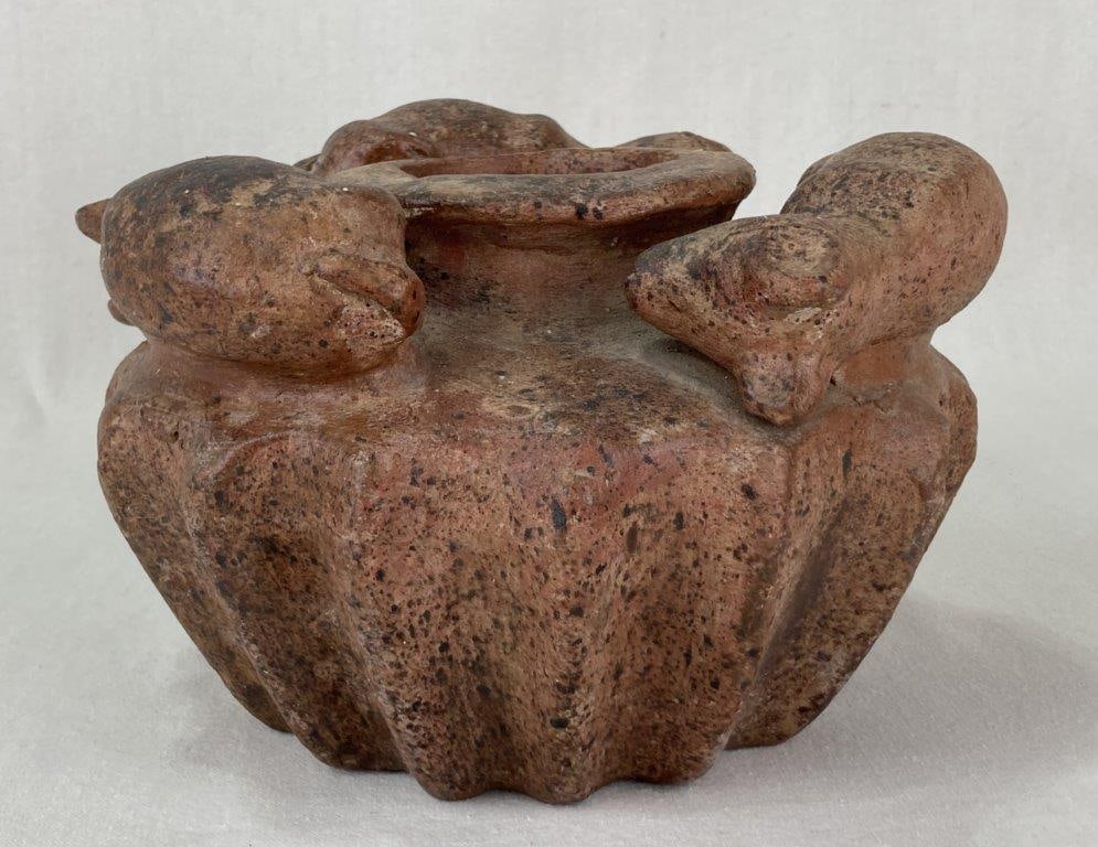 Terracotta Effigy Pot: An effigy pot, possibly of Mexican origin, made of terracotta with a black speckled appearance featuring four sculptural mouse figures arranged around the central opening and with a fluted lower