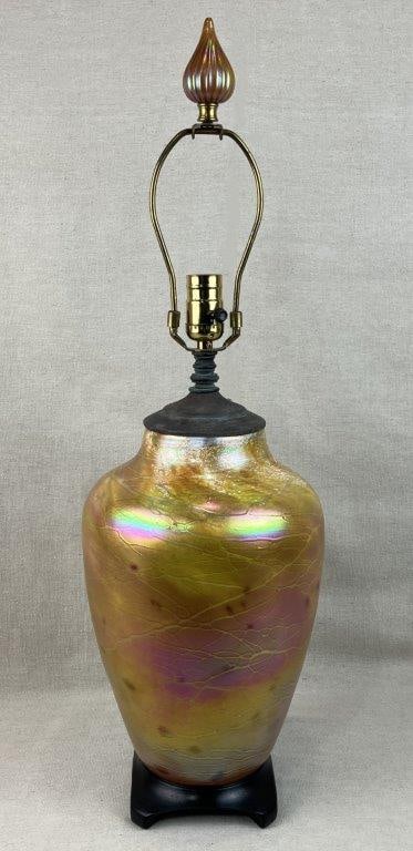 Tom Stoenner Signed American Studio Art Glass Lamp: This beautiful studio art glass lamp by acclaimed artisan Tom Stoenner showcases an iridescent, luster-style hand-blown form featuring a vibrant palette of yellow, warm orange, and pink luster tones.