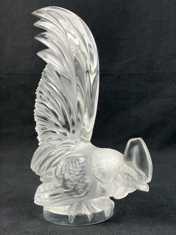 Lalique Art Glass Rooster: This exceptional Lalique art glass rooster, originally titled Coq Nain (translating from French as the "dwarf rooster"), was designed in 1928 by RenÃ© Lalique. Conceived during the Art Deco